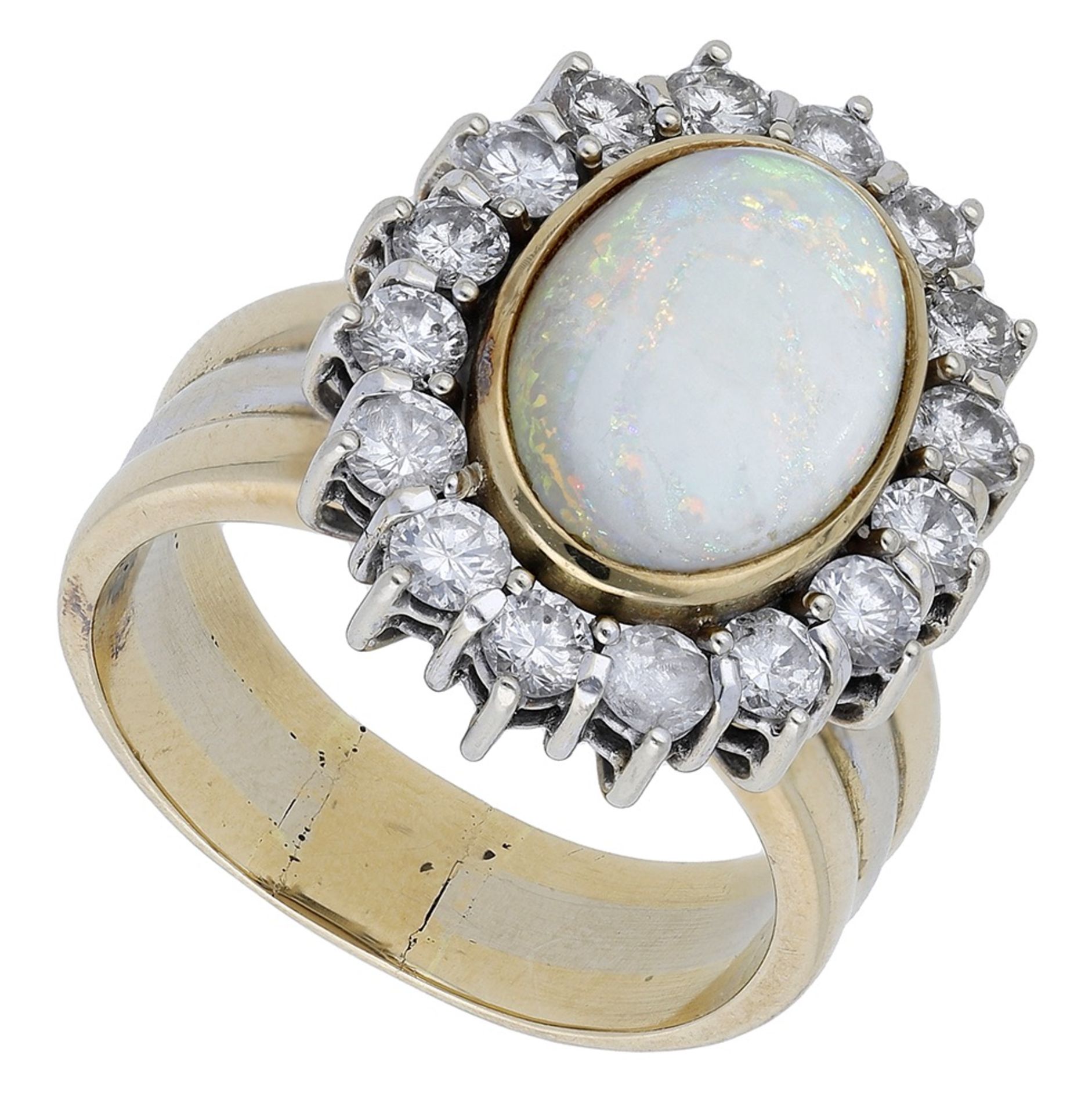An opal and diamond cluster ring, the oval opal cabochon collet set within a brilliant-cut d...