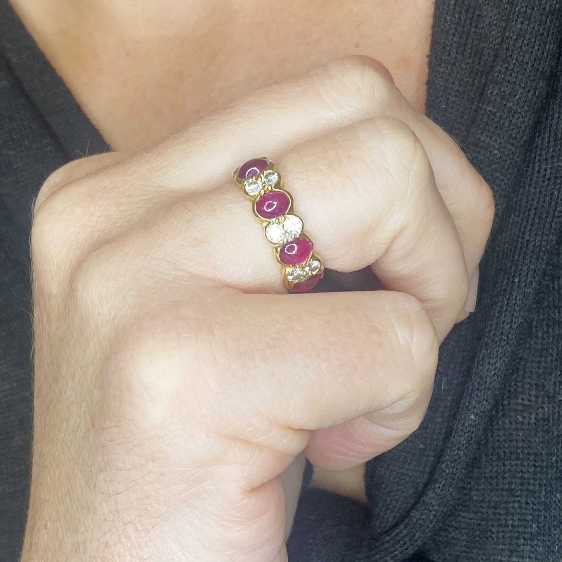 An 18ct gold ruby and diamond eternity ring, the cabochon rubies spaced by duos of brilliant... - Image 3 of 3