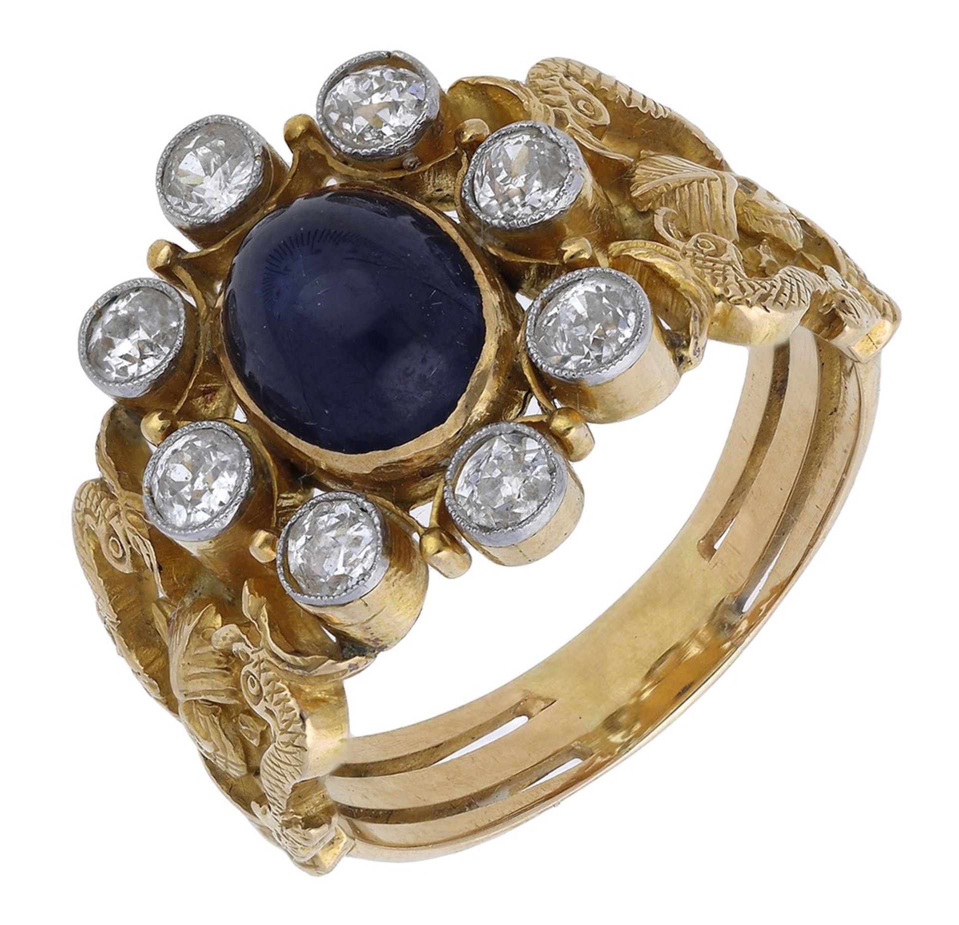 A sapphire and diamond ring, the oval sapphire cabochon within a surround of old brilliant-c...