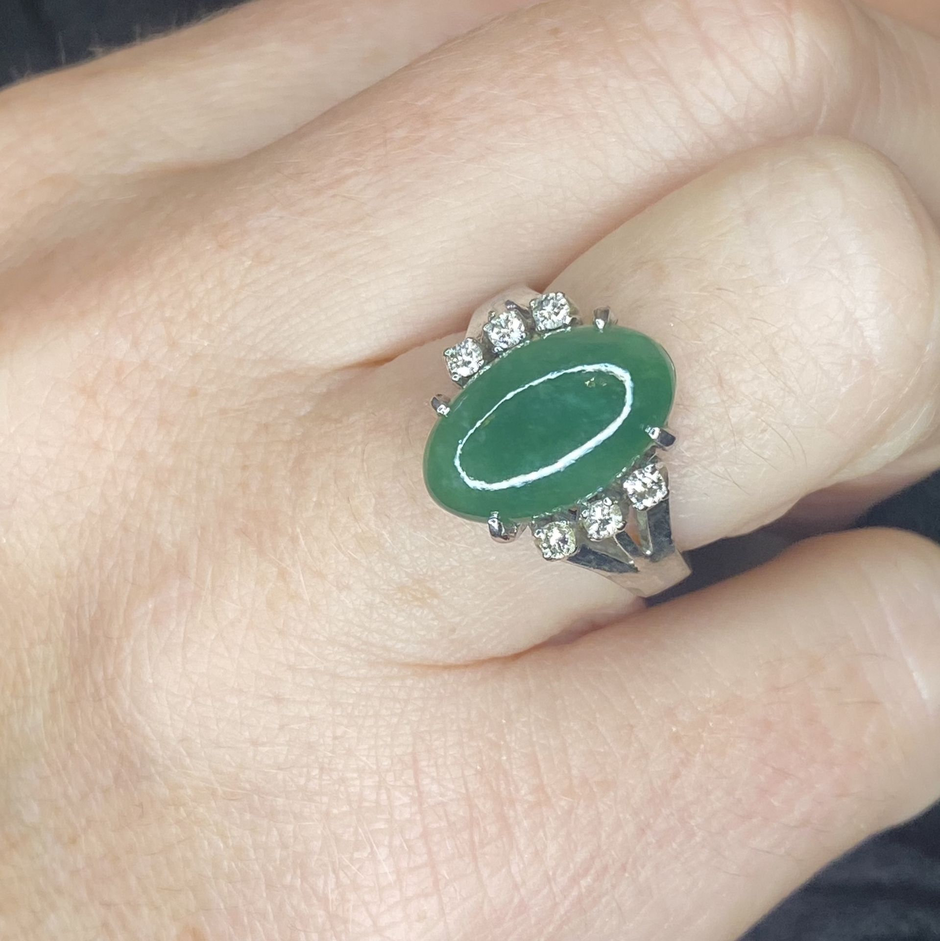 A jade and diamond ring, the oval jade cabochon with a trio of brilliant-cut diamonds to eit... - Image 3 of 3