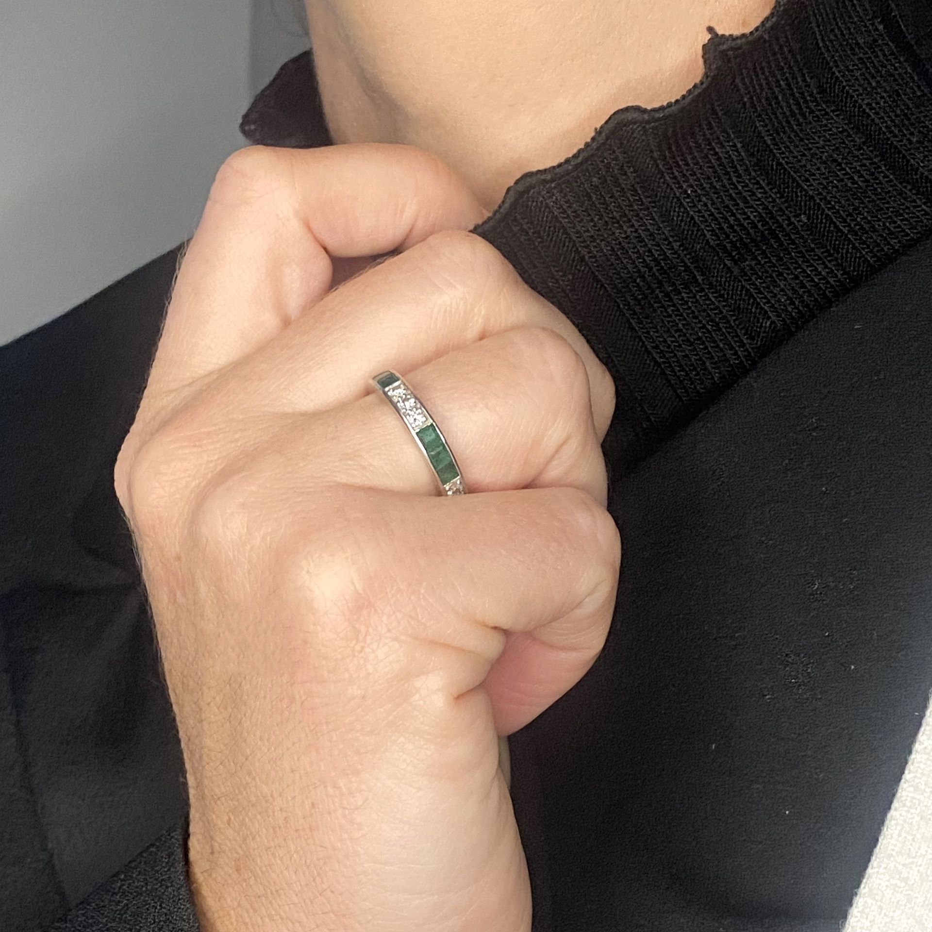 An emerald and diamond eternity ring, set throughout with alternating trios of brilliant-cut... - Image 2 of 2