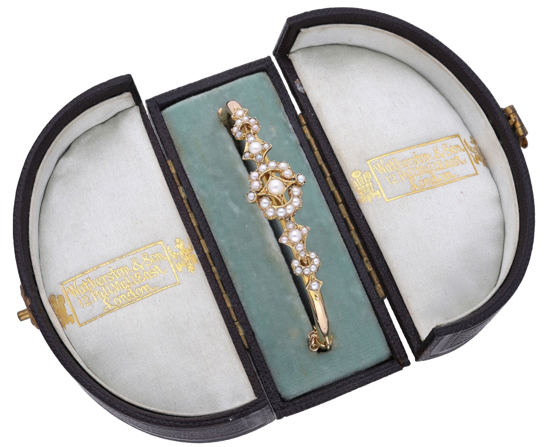A gold and pearl bangle, circa 1900, the hinged bangle set to the front with openwork seed p...