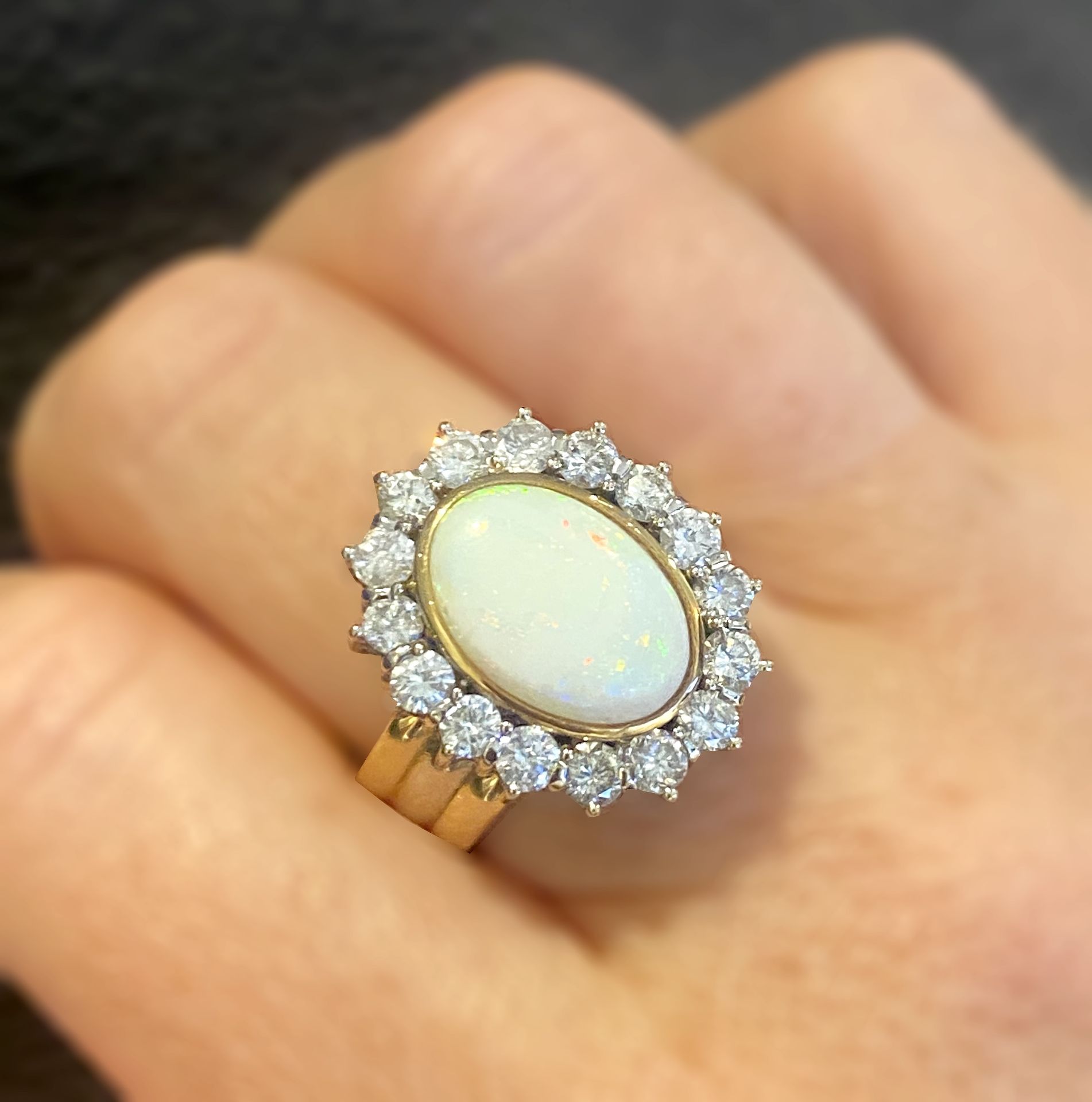 An opal and diamond cluster ring, the oval opal cabochon collet set within a brilliant-cut d... - Image 3 of 3