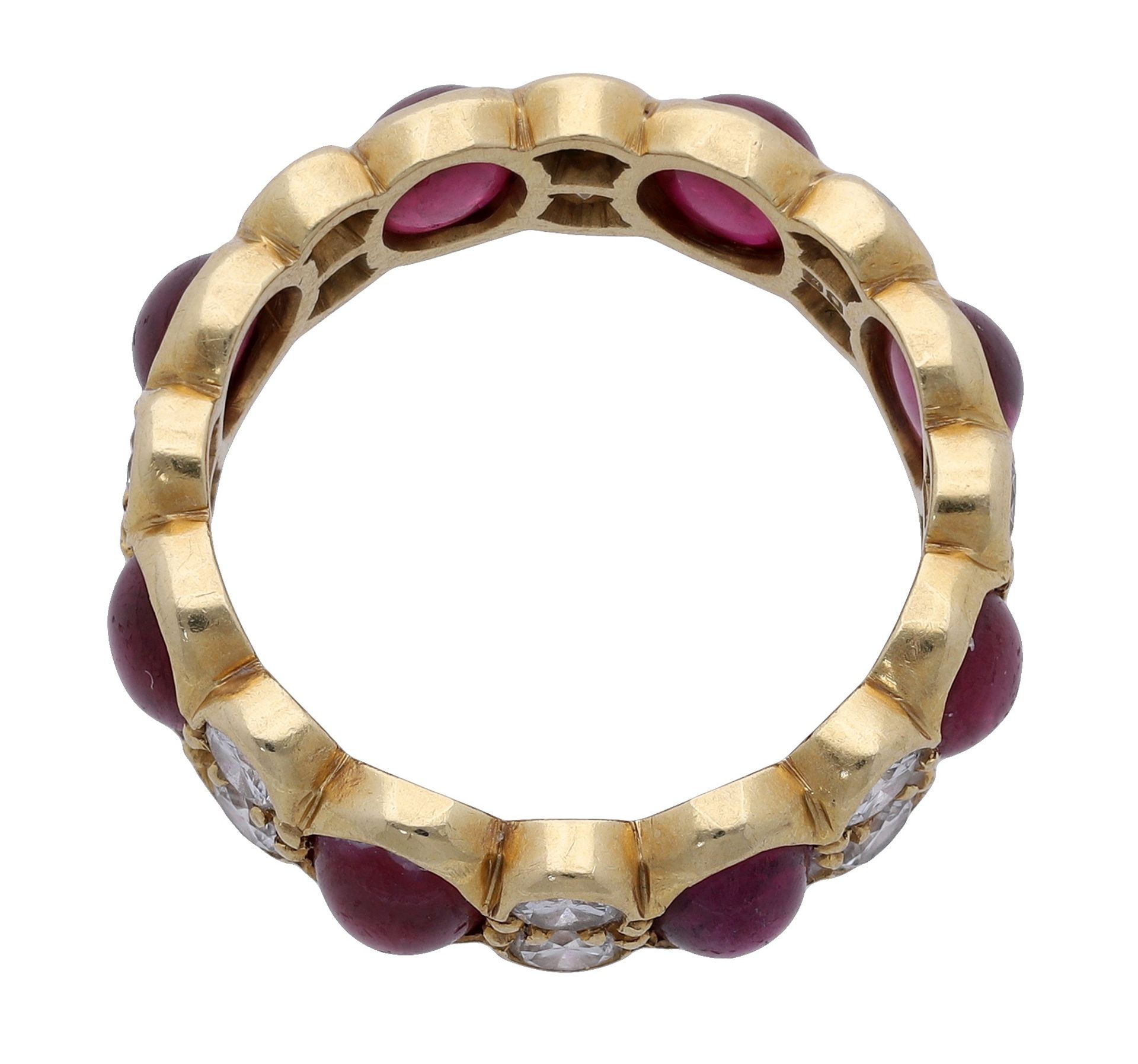 An 18ct gold ruby and diamond eternity ring, the cabochon rubies spaced by duos of brilliant... - Image 2 of 3