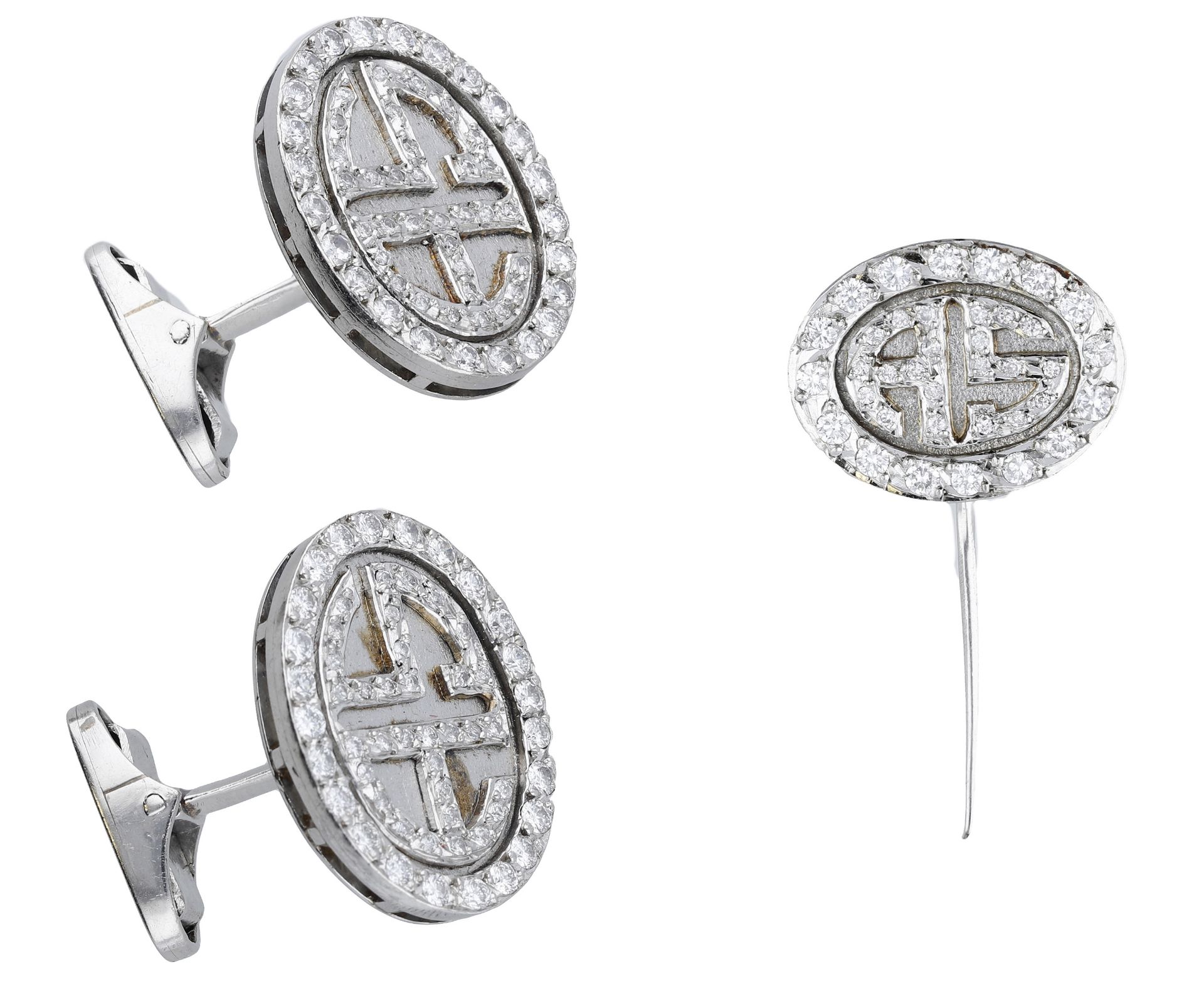 A diamond cufflink and tie pin suite, the oval plaques with applied brilliant-cut diamond mo...