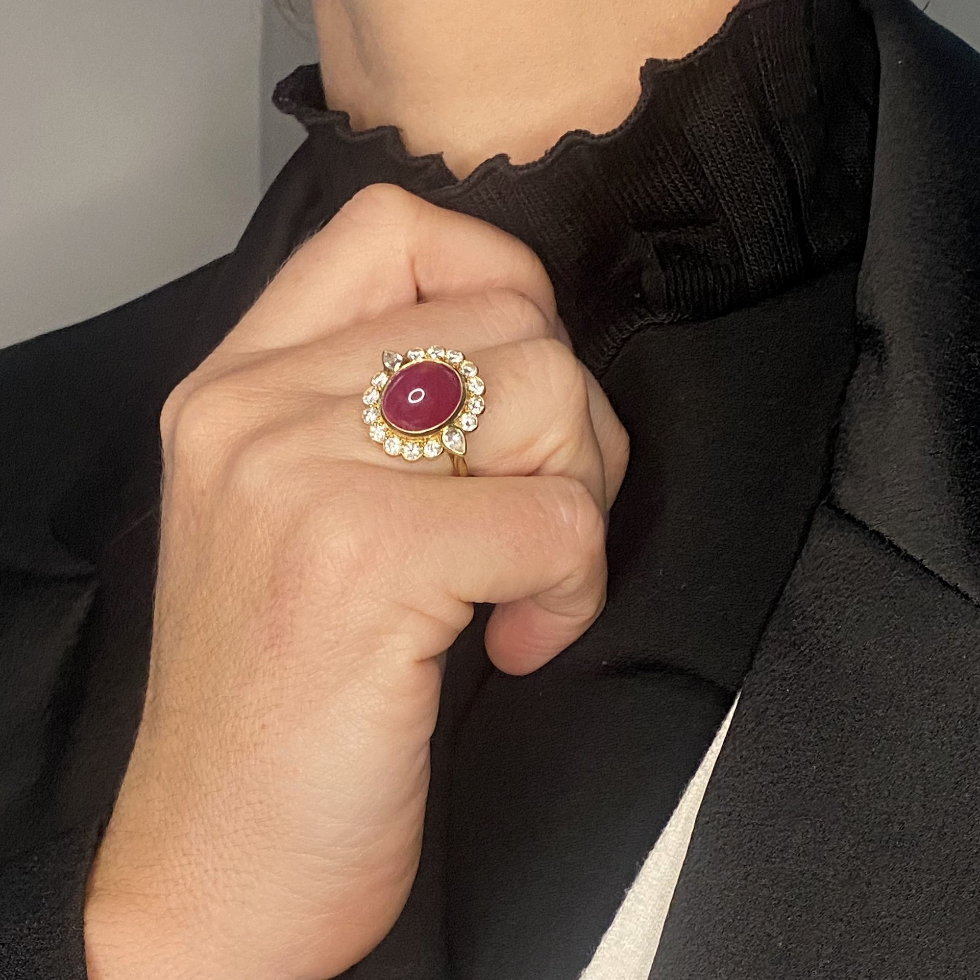 An 18ct gold cabochon ruby and diamond cluster ring, the ruby cabochon centred within a bril... - Image 3 of 3