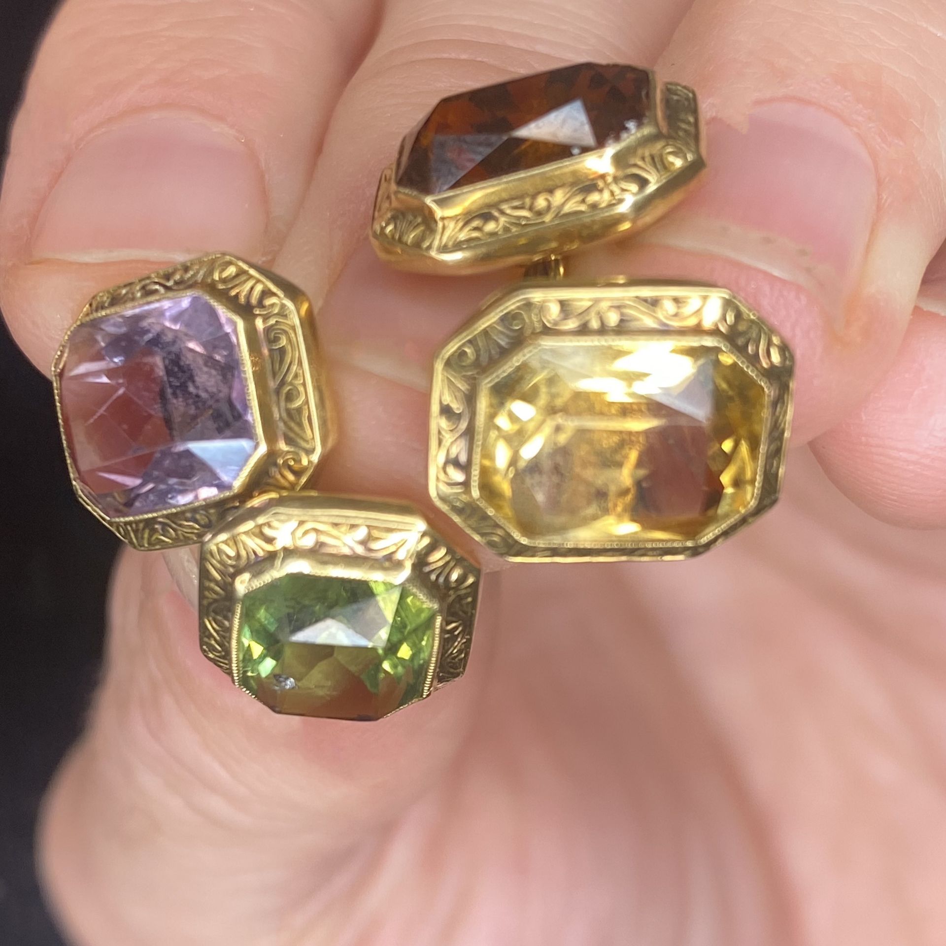 A pair of gem-set cufflinks, set with a combination of octagonal-cut peridot, amethyst and c... - Image 3 of 3