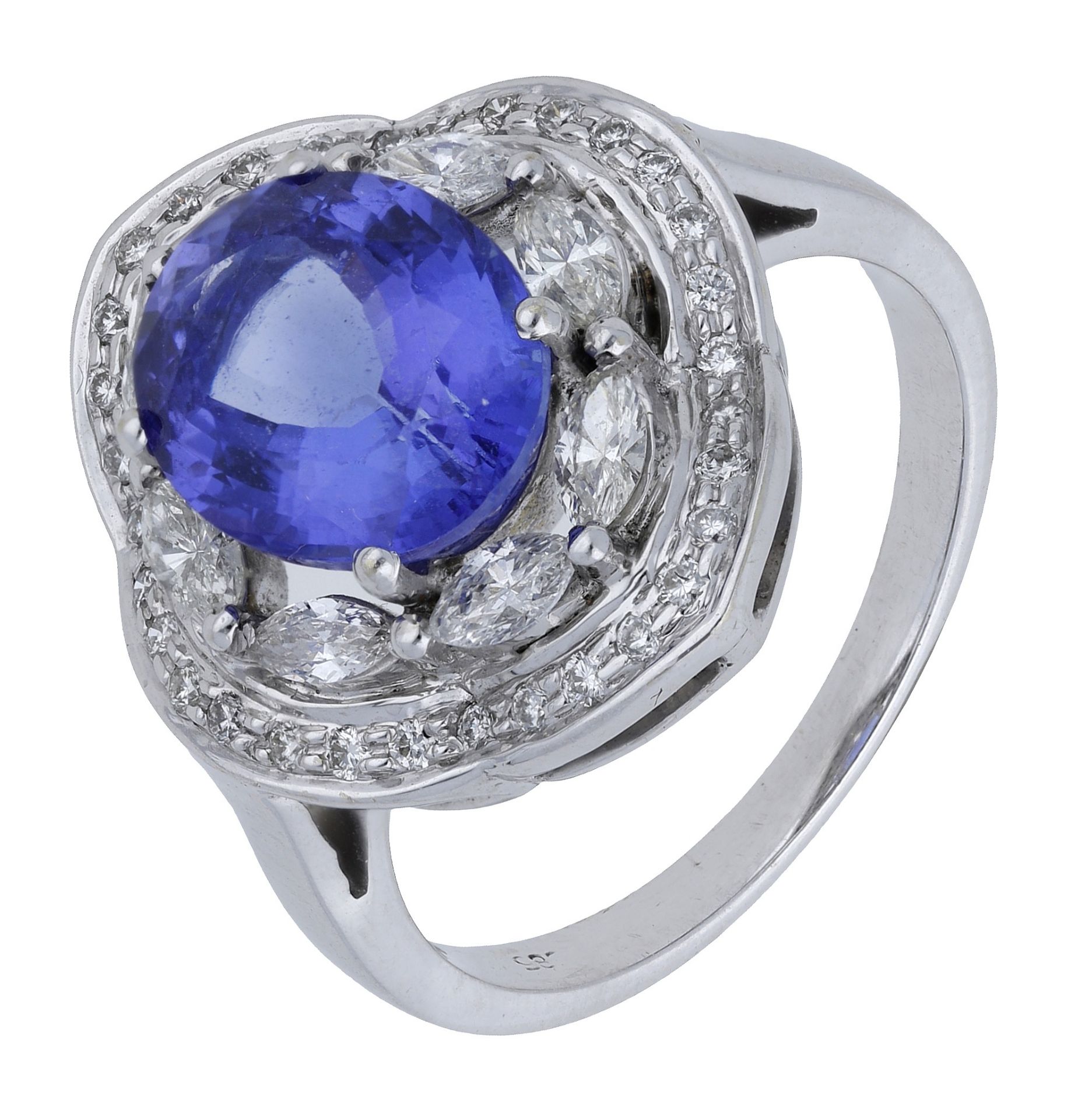 A tanzanite and diamond cluster ring, set with an oval mixed-cut tanzanite within an undulat...