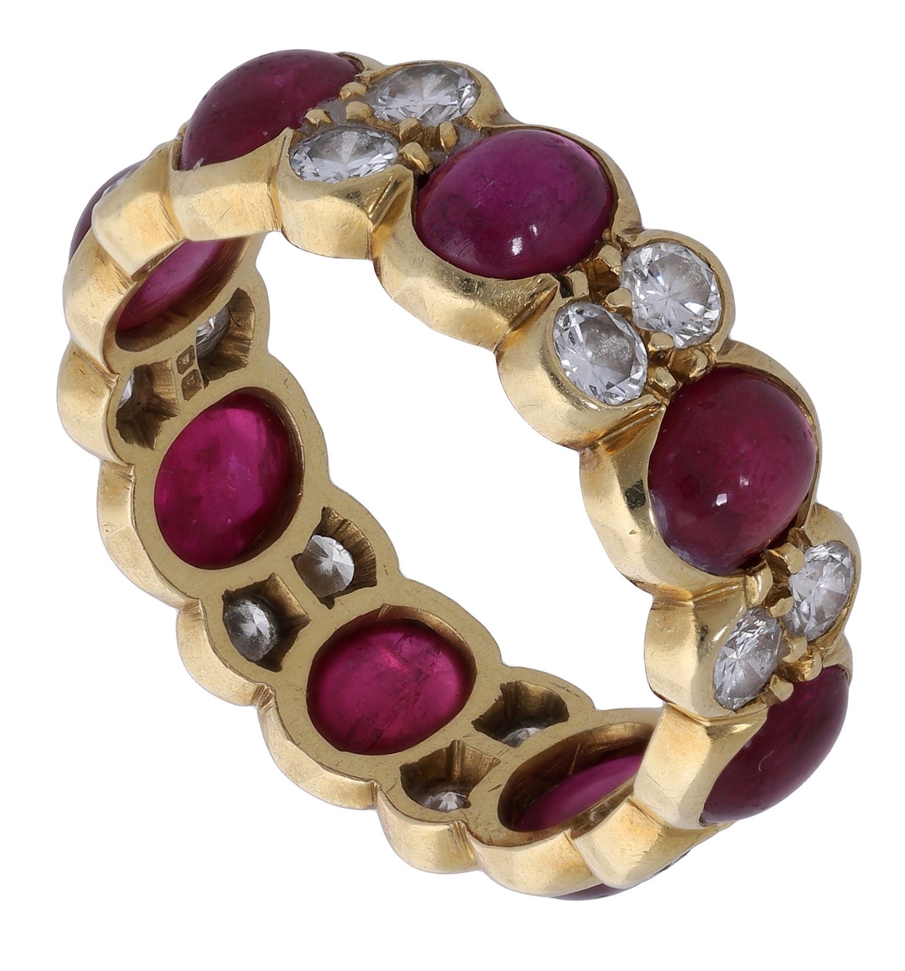 An 18ct gold ruby and diamond eternity ring, the cabochon rubies spaced by duos of brilliant...