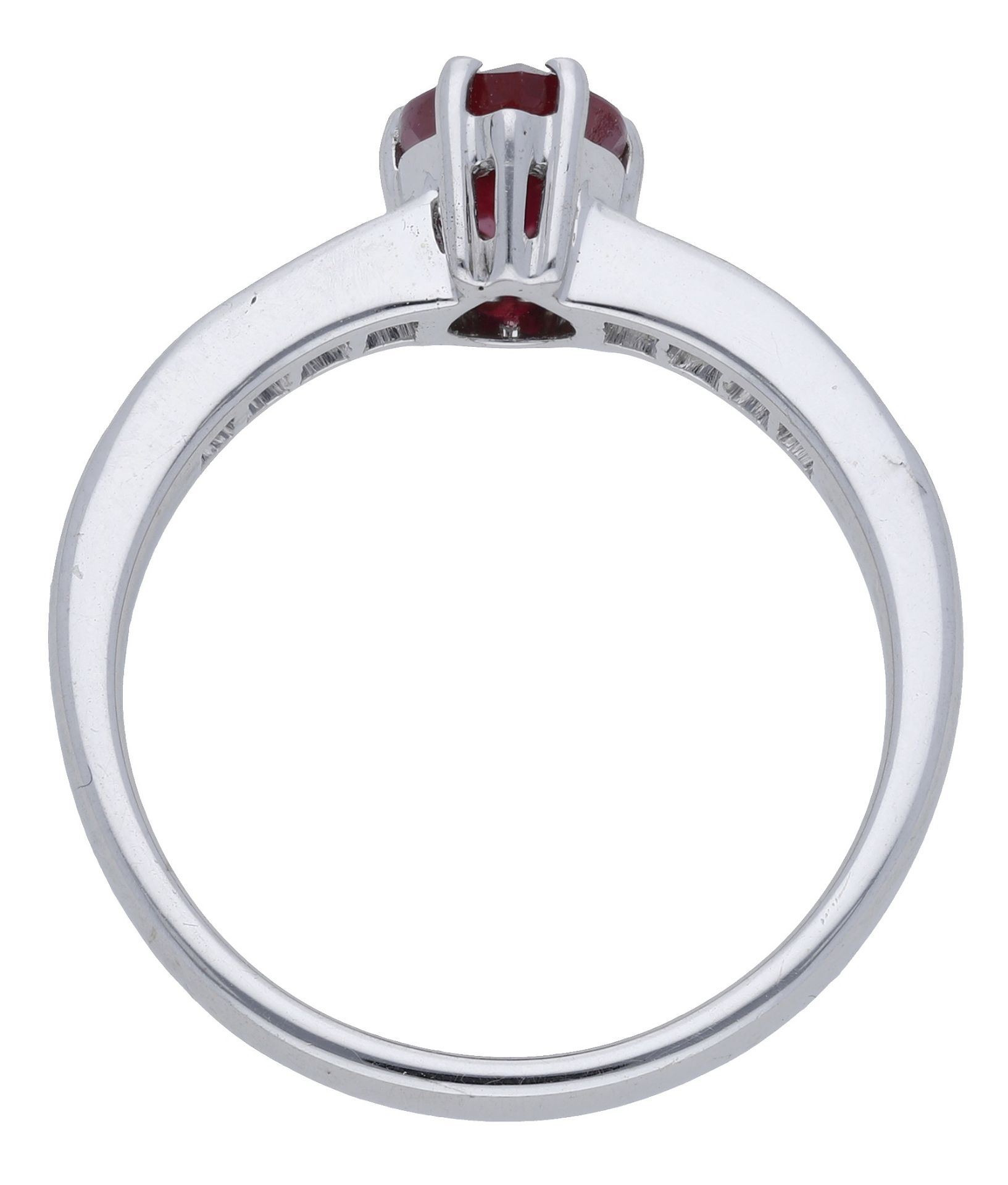 A ruby and diamond ring, the pear-shaped ruby claw-set to princess-cut diamond shoulders, st... - Image 2 of 3