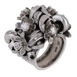 A diamond dress ring, the bombÃ© ring formed of scrolling foliage and flowerheads scattered w...