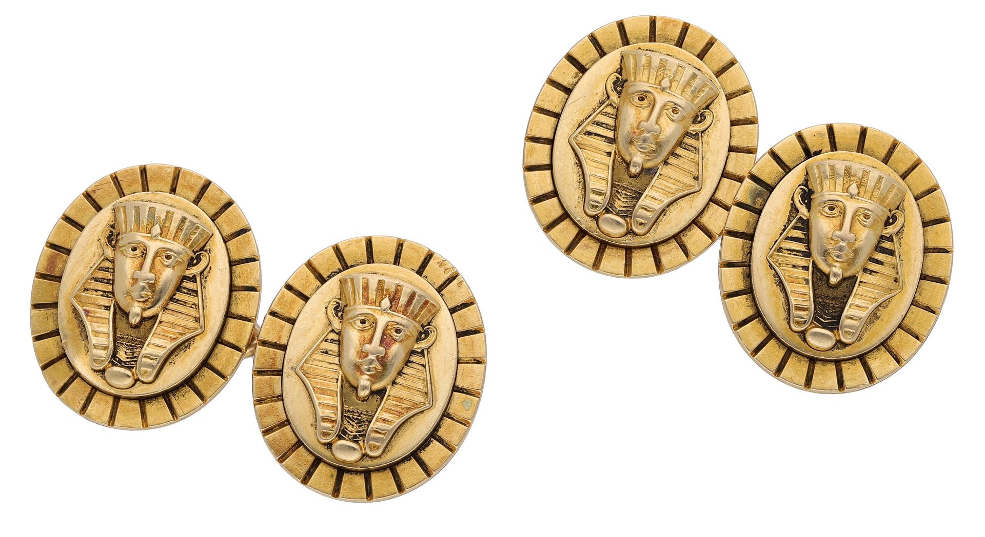 A pair of novelty cufflinks, the oval panels modelled as the mask of Tutankhamun, to figure-...