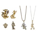 A small collection of Disney charms and pendants, including a bicolour 9ct gold articulated...