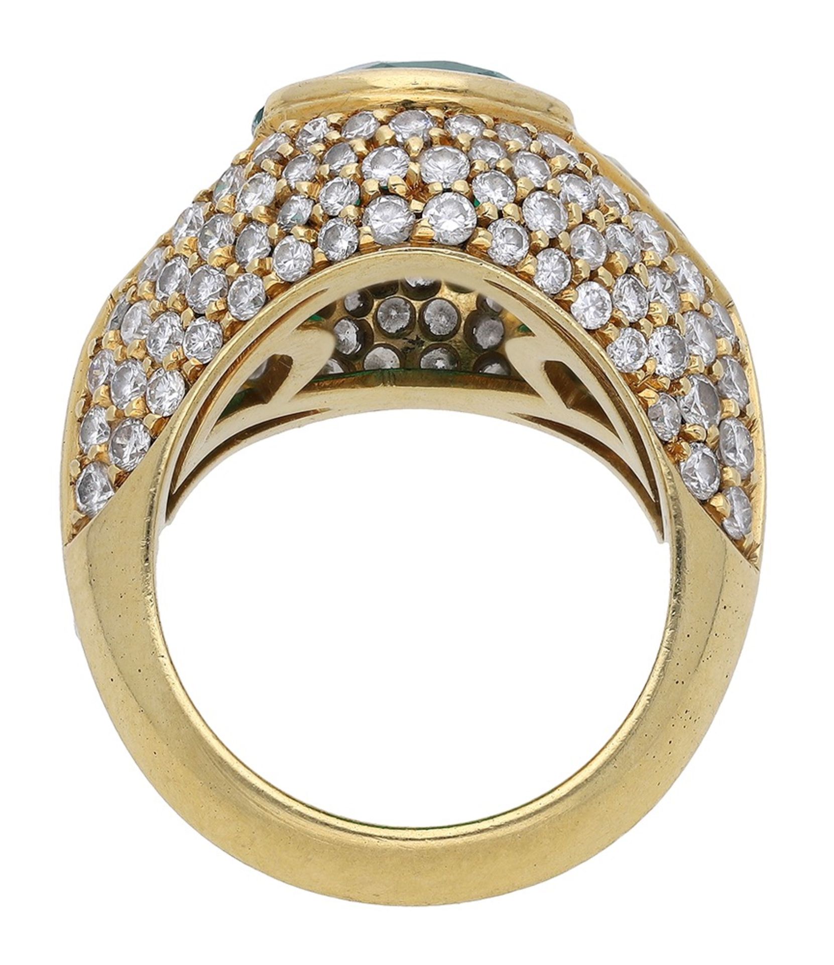 An emerald and diamond dress ring, set with an oval mixed-cut emerald between two triangular... - Image 2 of 3