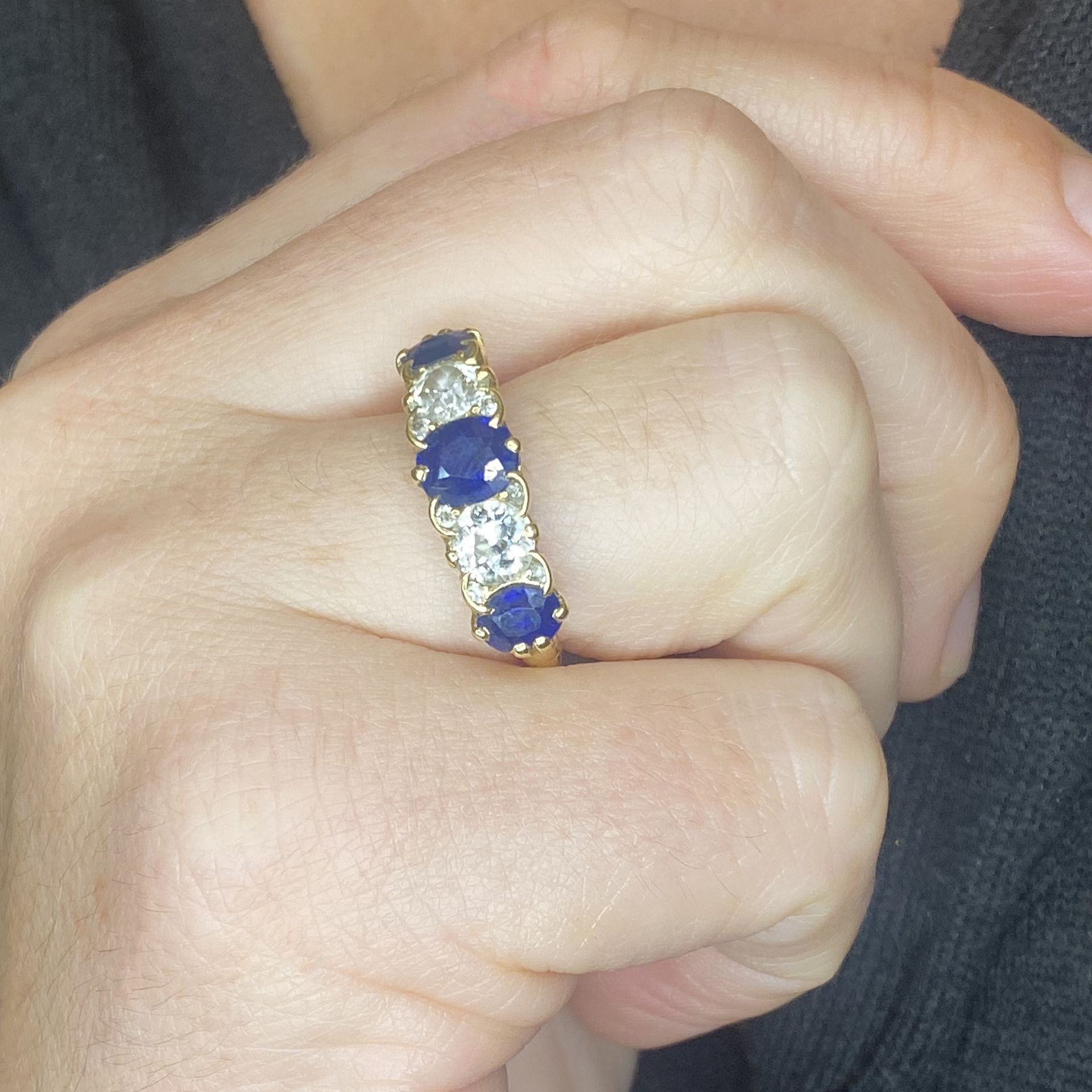 A sapphire and diamond five stone ring, comprising a principal circular-cut and two oval-cut... - Image 3 of 3