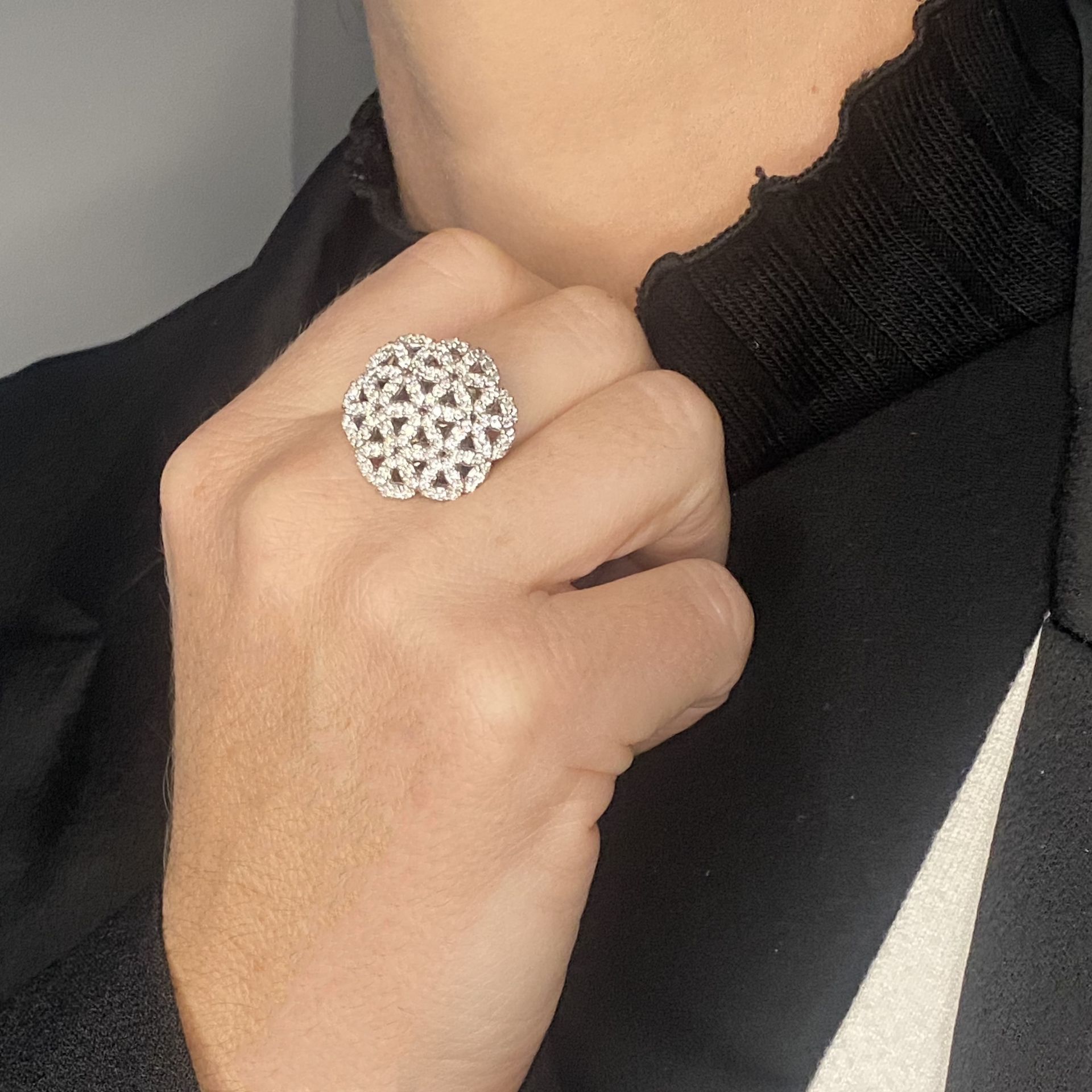 A diamond set dress ring, composed of pierced brilliant-cut diamond flower head clusters, st... - Image 3 of 3