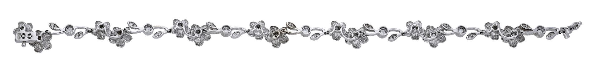 An 18ct white gold and diamond flowerhead bracelet, the diamond-set flowerhead duos spaced b... - Image 2 of 3