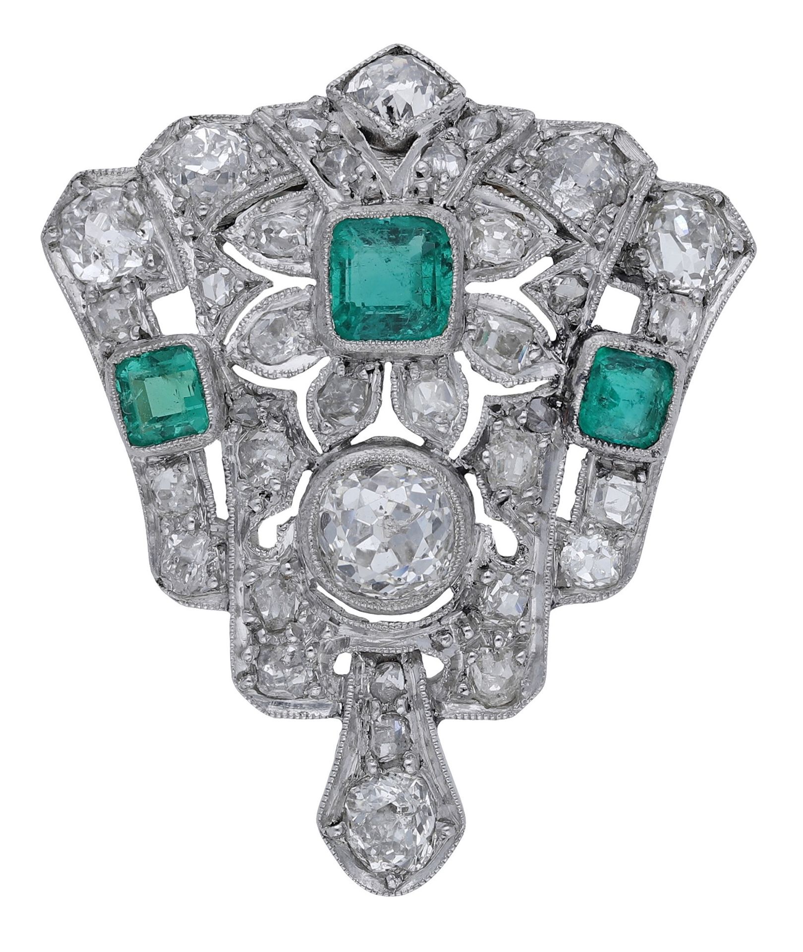 An Art Deco emerald and diamond clip, the tapering clip with foliate detailing and set with...