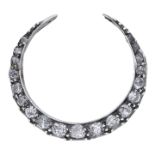 A diamond crescent brooch, circa 1890, set throughout with graduated old-cut diamonds, gold...