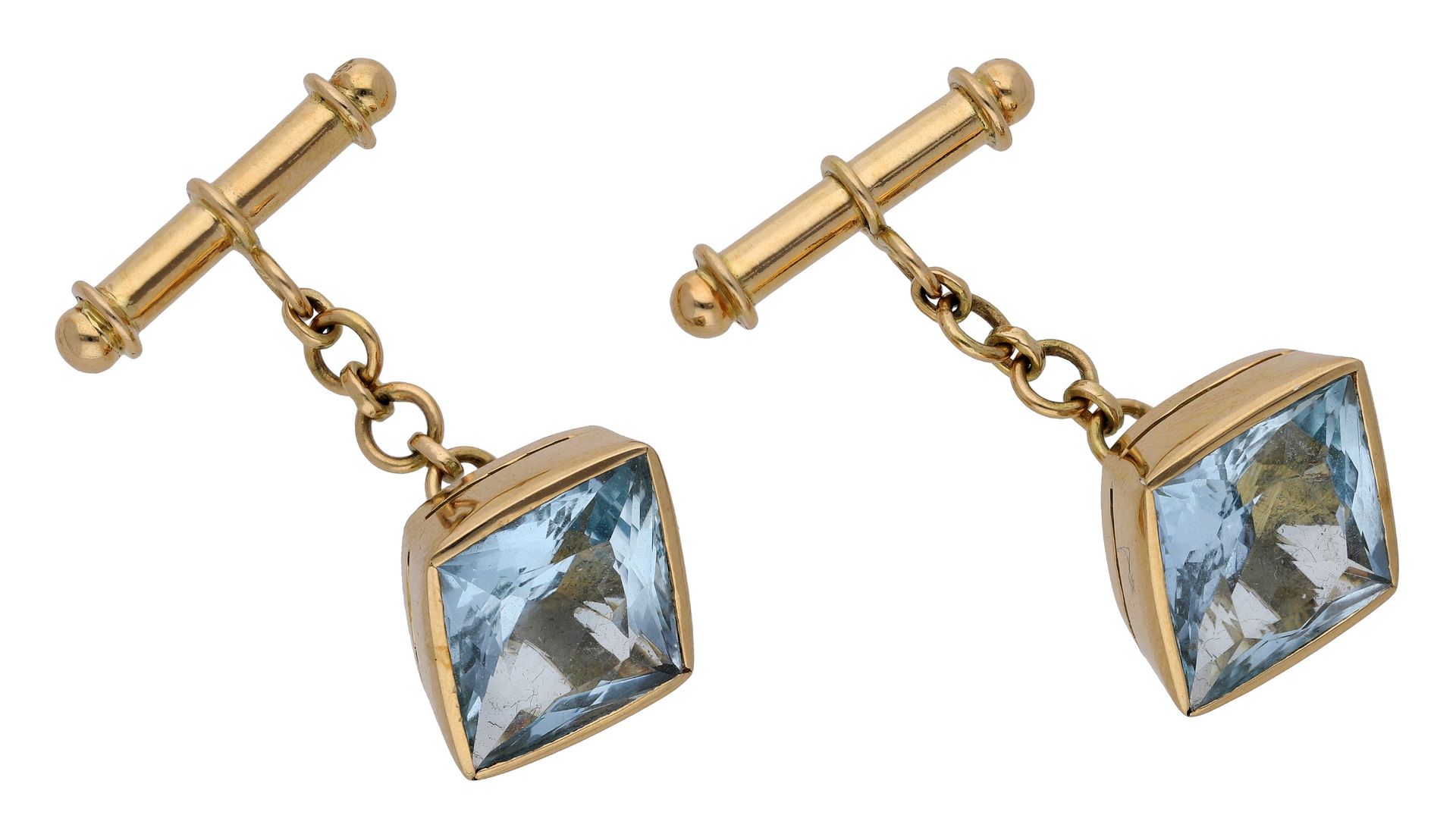 A pair of aquamarine cufflinks, the fancy-cut aquamarines collet-set to chain connections an...