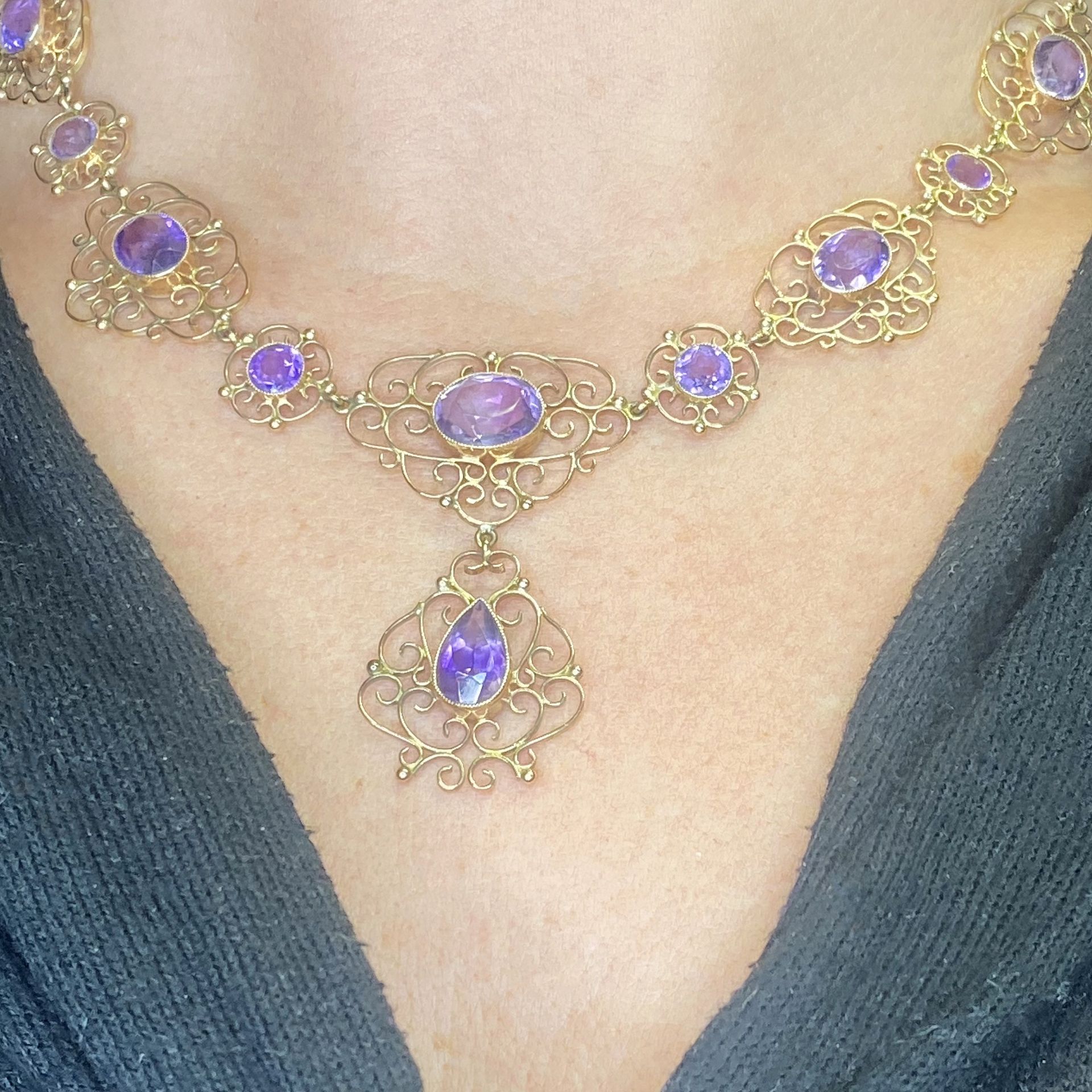 A late 19th century amethyst necklace, the cable-link chain leading to a graduated series of... - Image 3 of 3
