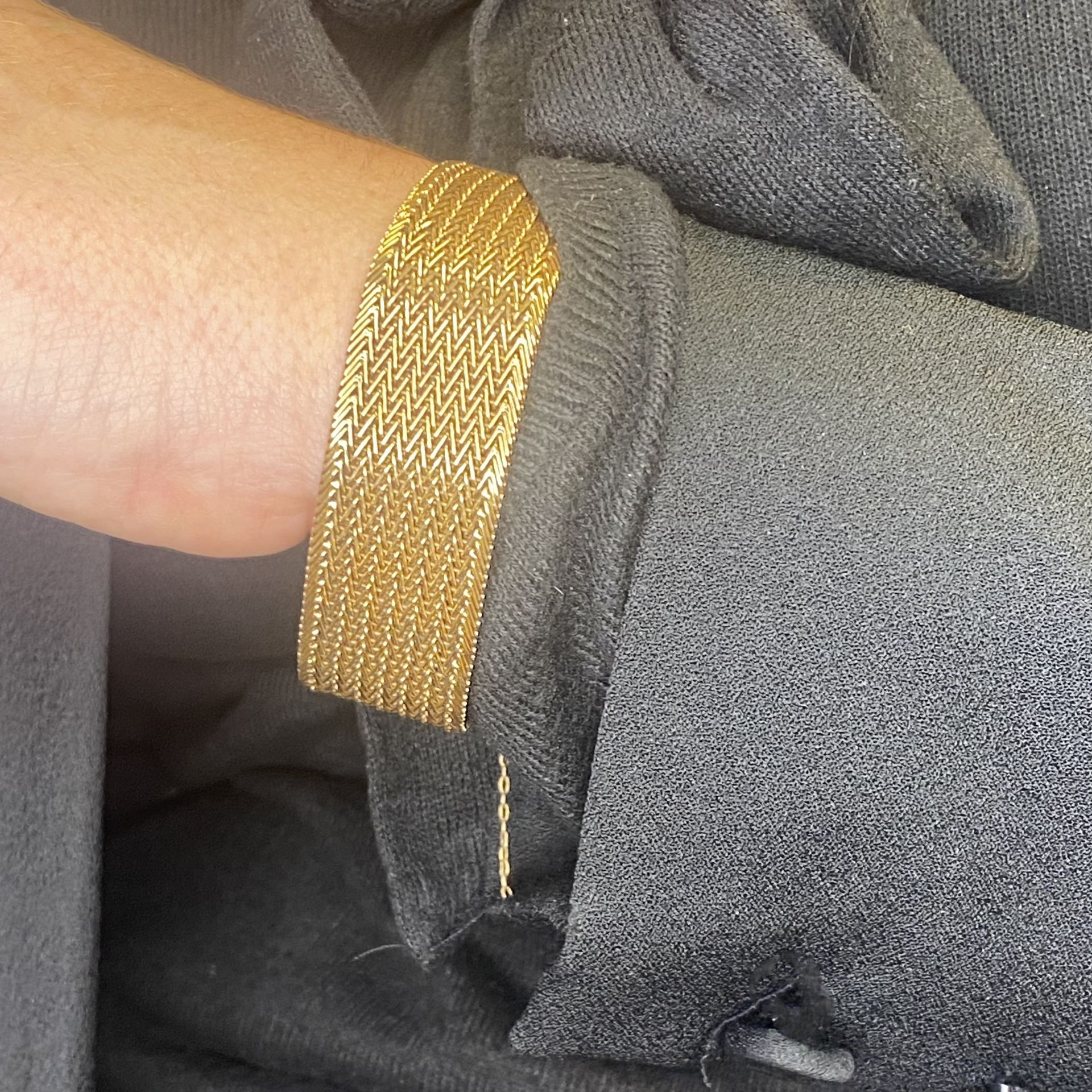 A fancy-link bracelet, designed as a woven herringbone strap, stamped '18K', length 18cm. Â£... - Image 3 of 4