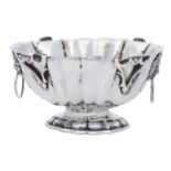 A small silver bowl, probably German, of oval fluted form, with four applied vacant c...