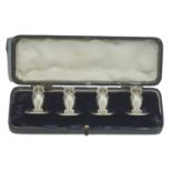 A set of four silver owl menu holders, by Sampson Mordan & Co., Chester 1913, realis...