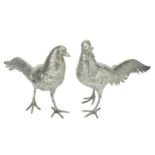 A pair of large Continental silver cockerel and hen table ornaments, realistically m...