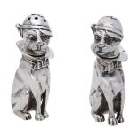 A pair of silver condiments, modelled as seated dogs, 20th century, both wearing caps, w...