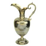 A Victorian silver gilt ewer, by Edward Charles Brown, London 1874, with hinged lid,...