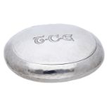 A silver oval tobacco box, by Ramsden & Carr, Birmingham 1914, with spot hammered f...