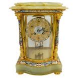 FRENCH ONYX AND CHAMPLEVE ENAMEL FOUR GLASS CLOCK CIRCA 1900 the bow fronted clock flanked by