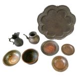 GROUP OF PERSIAN TINNED COPPER WARES 19TH CENTURY comprising a large tray, three circular dishes,