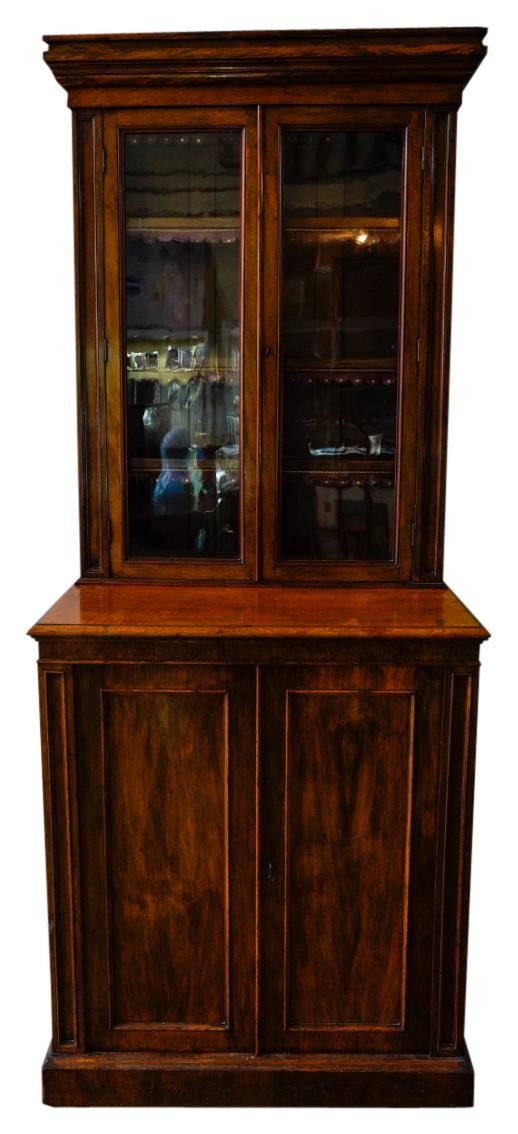 A 19TH CENTURY POLLARDED OAK PANELLED BOOKCASE ON CUPBOARD, the bookcase section comprising of three