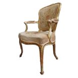 LOUIS XV GILTWOOD FAUTEUIL 18TH CENTURY the shaped back, padded arms and serpentine shaped seat