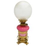 'ARTS AND CRAFTS' GLASS AND GILT-METAL OIL LAMP BY HINKS AND SONS CIRCA 1900 the pink glass
