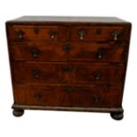 QUEEN ANNE WALNUT AND FEATHER BANDED CHEST OF DRAWERS 18TH CENTURY the rectangular caddy moulded top