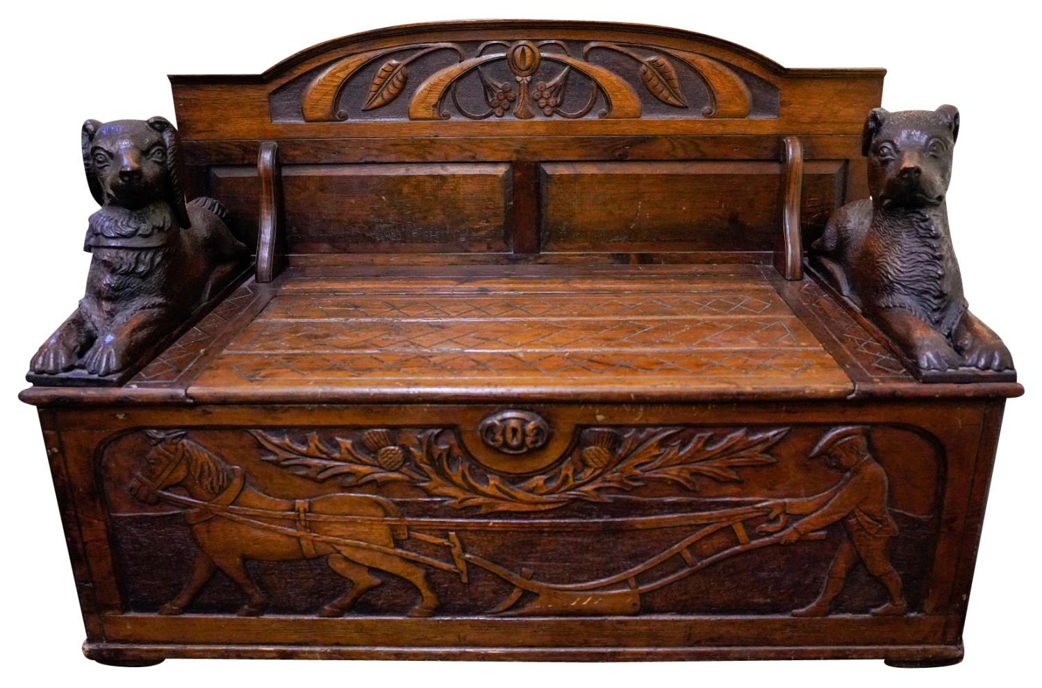 CARVED STAINED SOFTWOOD 'BLACKFOREST' HALL BENCH WITH 19TH CENTURY ELEMENTS the arched panelled back