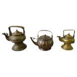 THREE SOUTH EAST ASIAN BRASS WATER KETTLES 19TH CENTURY largest, 27cm high, smallest, 22cm high
