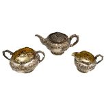 GEORGE IV SILVER THREE PIECE TEA SERVICE LONDON 1822 comprising a teapot, creamer and a sugar