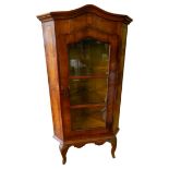 CONTINENTAL WALNUT AND INLAID CORNER CABINET 19TH CENTURY the domed top above one glazed panel