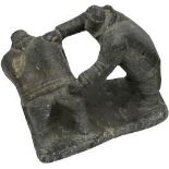 A GOOD INUIT SOAPSTONE CARVING OF TWO WRESTLING FIGURES, the base inscribed with an indistinct