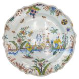 RARE SINCENY OR ROUEN CHIONOISERIE DECORATED FAIENCE DISH  CIRCA 1740 decorated with a scene of