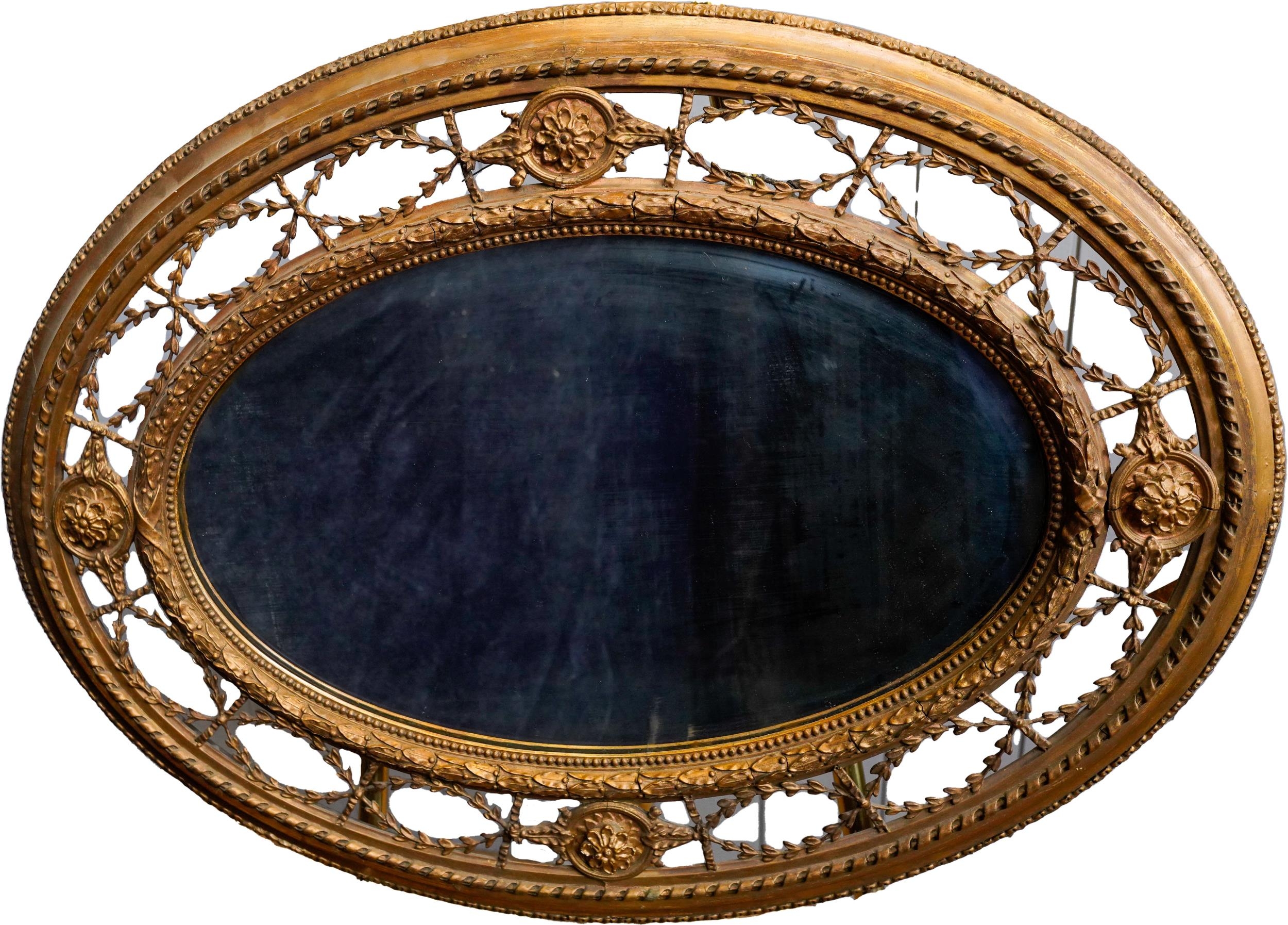 VICTORIAN GILTWOOD AND GESSO OVAL WALL MIRROR 19TH CENTURY the oval plate within an ornate
