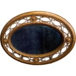 VICTORIAN GILTWOOD AND GESSO OVAL WALL MIRROR 19TH CENTURY the oval plate within an ornate