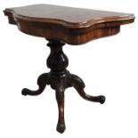 A VICTORIAN BURR WALNUT FOLDING CARD TABLE, a serpentine edge top supported by a turned baluster