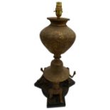 IMPRESSIVE PERSIAN BRASS LAMP 19TH CENTURY engraved with figures and scrolling foliage, raised on