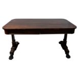 GEORGE IV ROSEWOOD LIBRARY TABLE CIRCA 1830 the rounded rectangular top above two frieze drawers,