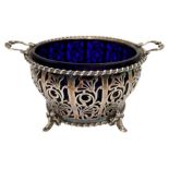 SILVER SUGAR BASKET CHESTER 1939 with a blue glass liner 15cm wide 170 grams. PROVENANCE : Private